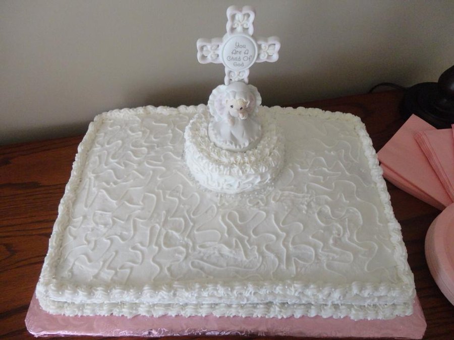 White baptism sheet cake with a cross and lamb topper